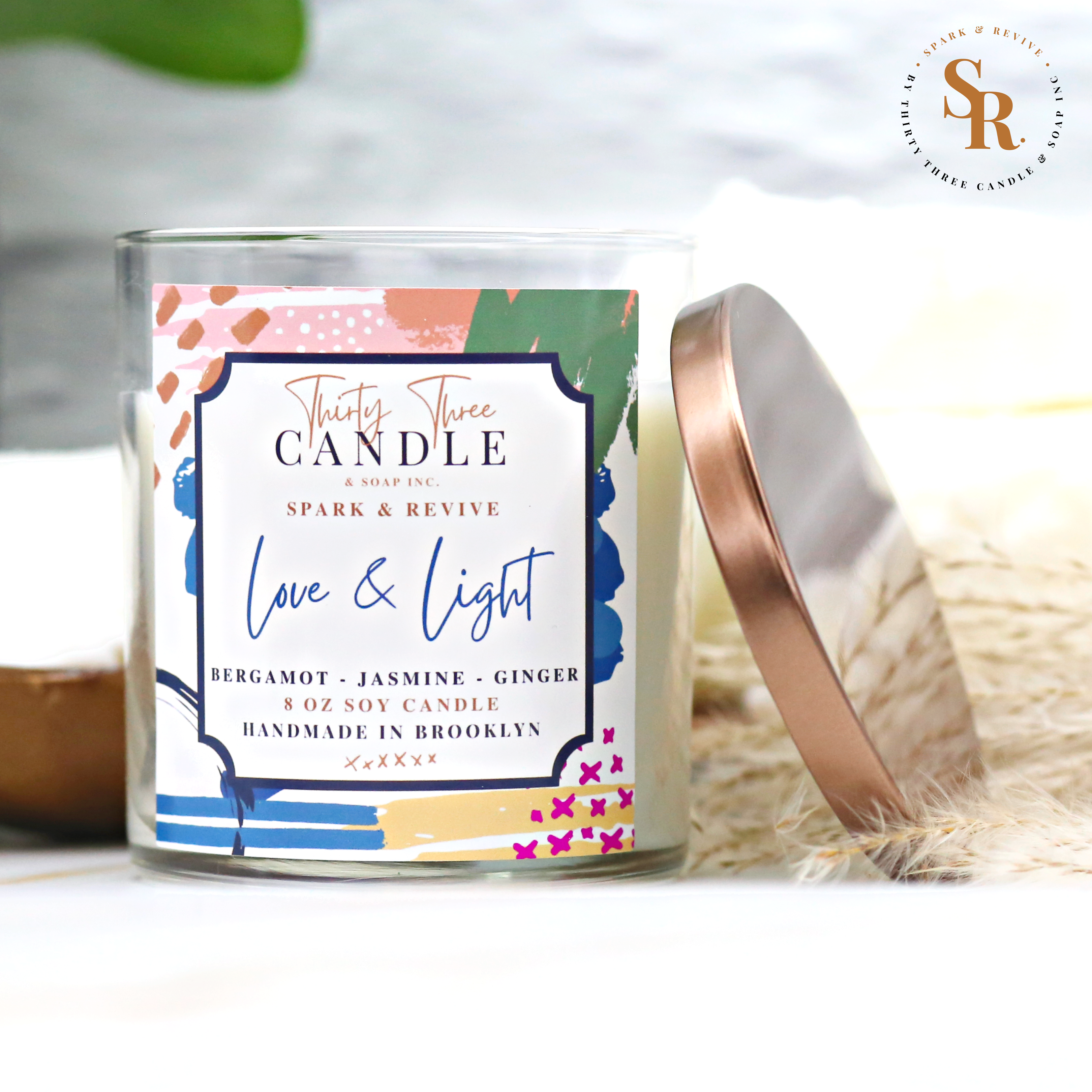 Uplift and transform your space with the soothing scent of our Love & Light scented soy candle.  Bringing the ultimate spa experience to your space with an ethereal quality, Love & Light has fresh top notes of mandarin and lemongrass. Elevating this luxurious scent are mid notes of bergamot and ginger. These fragrances blend beautifully with delicate jasmine and white tea to calm your senses and shed the outside world. @SparkandRevive