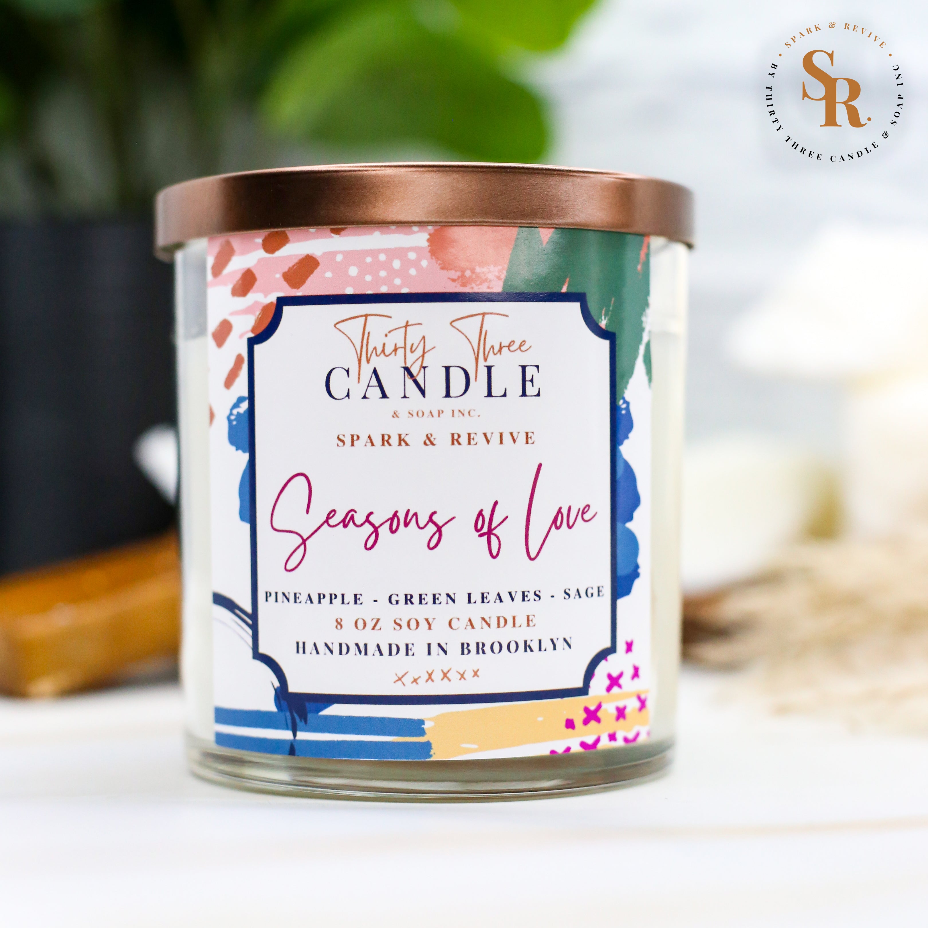 Uplift your mood and awaken your senses with our Seasons of Love scented soy candle. Seasons of Love is a sweet but not overwhelming blend of pineapple, sage, and green leaves. It is sure to put you in good spirits and bring love to your day.  Seasons of Love is infused with natural essential oils, including eucalyptus, cedar, vetiver, palmarosa, clary sage, lemongrass, amyris, black pepper, cade, and blue chamomile flower. @SparkandRevive