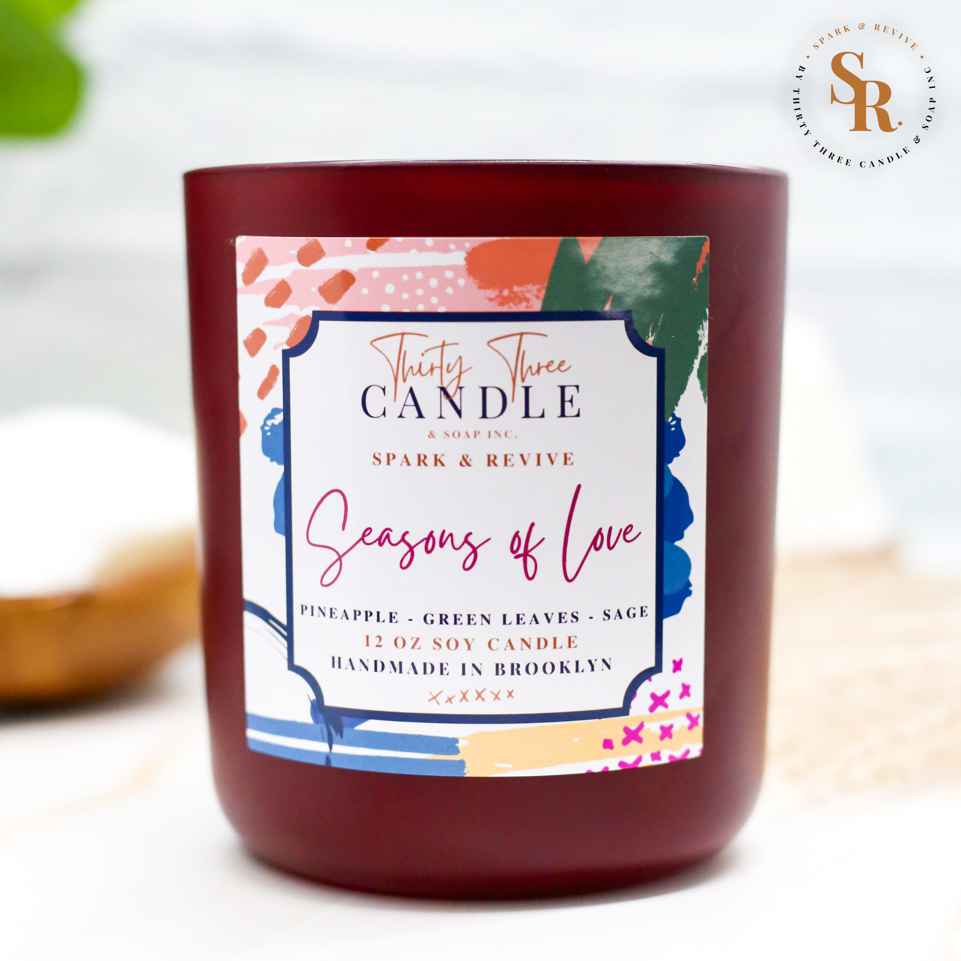 Uplift your mood and awaken your senses with our Seasons of Love scented soy candle. Seasons of Love is a sweet but not overwhelming blend of pineapple, sage, and green leaves. It is sure to put you in good spirits and bring love to your day. Seasons of Love is infused with natural essential oils, including eucalyptus, cedar, vetiver, palmarosa, clary sage, lemongrass, amyris, black pepper, cade, and blue chamomile flower. @SparkandRevive